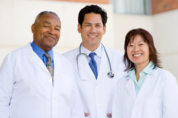 Three physicians standing together