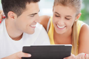 Young couple online with tablet computer
